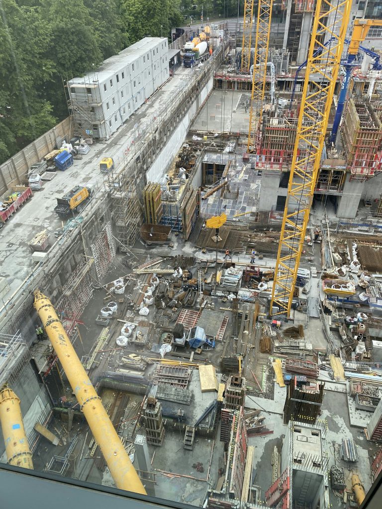 An aerial view of a cluttered and inactive construction site, illustrating a construction delay in Australia