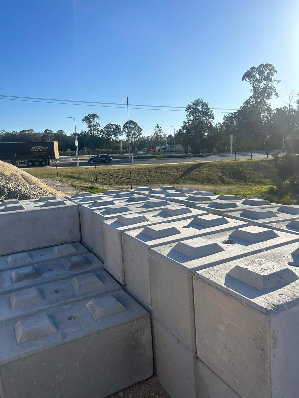 Retaining wall blocks with visible drainage holes designed for effective water management