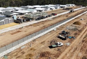 Precast concrete blocks in Australia used to construct a retaining wall at a residential development site