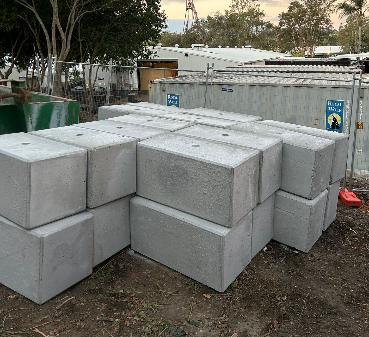 Precast concrete blocks in Australia stacked in a storage yard near a construction site