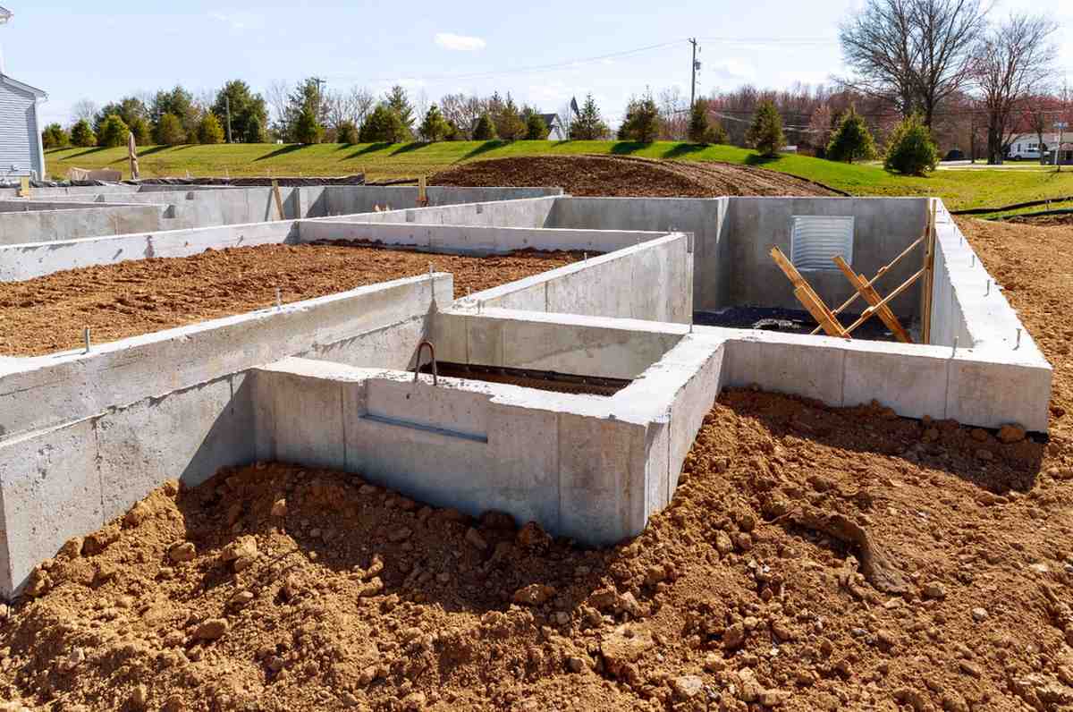 Precast concrete foundation walls at a construction site, showcasing durability and safety benefits of precast concrete fire protection.