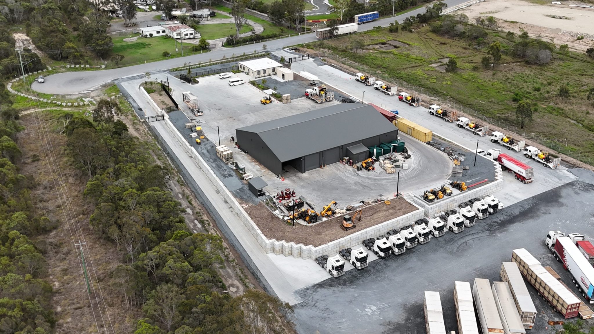 Aerial view of precast concrete retaining walls on the Gold Coast industrial facility, showcasing durable and eco-friendly construction.