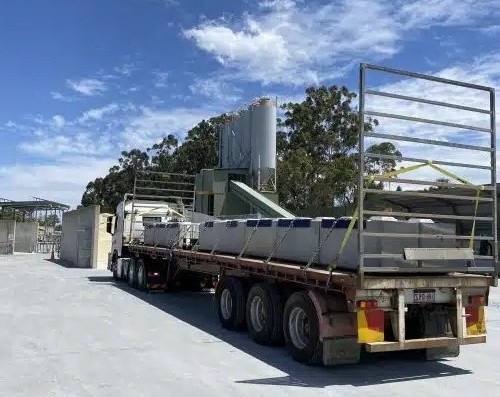 Recycled precast concrete blocks on the Gold Coast being delivered to an industrial construction site for sustainable building projects.
