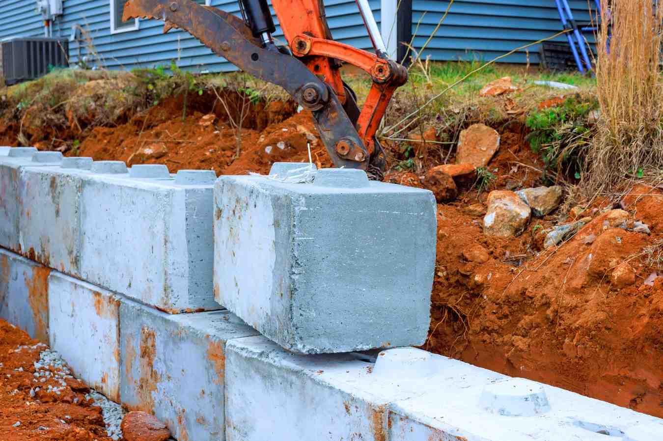 Concrete precast retaining walls being installed on the Gold Coast using construction machinery