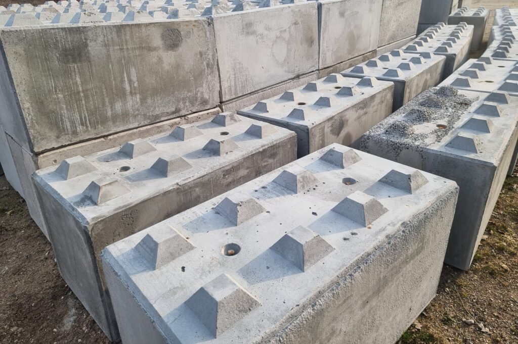 Close-up of recycled concrete blocks used in a retaining wall system for sustainable construction on the Gold Coast.