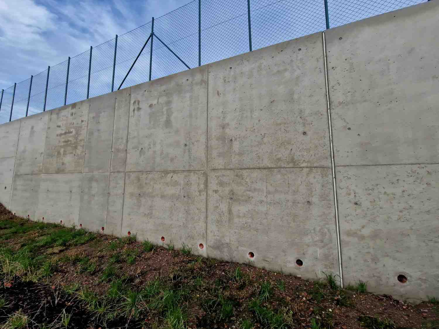 Concrete retaining wall drainage Gold Coast installation with evenly spaced weep holes for water pressure relief