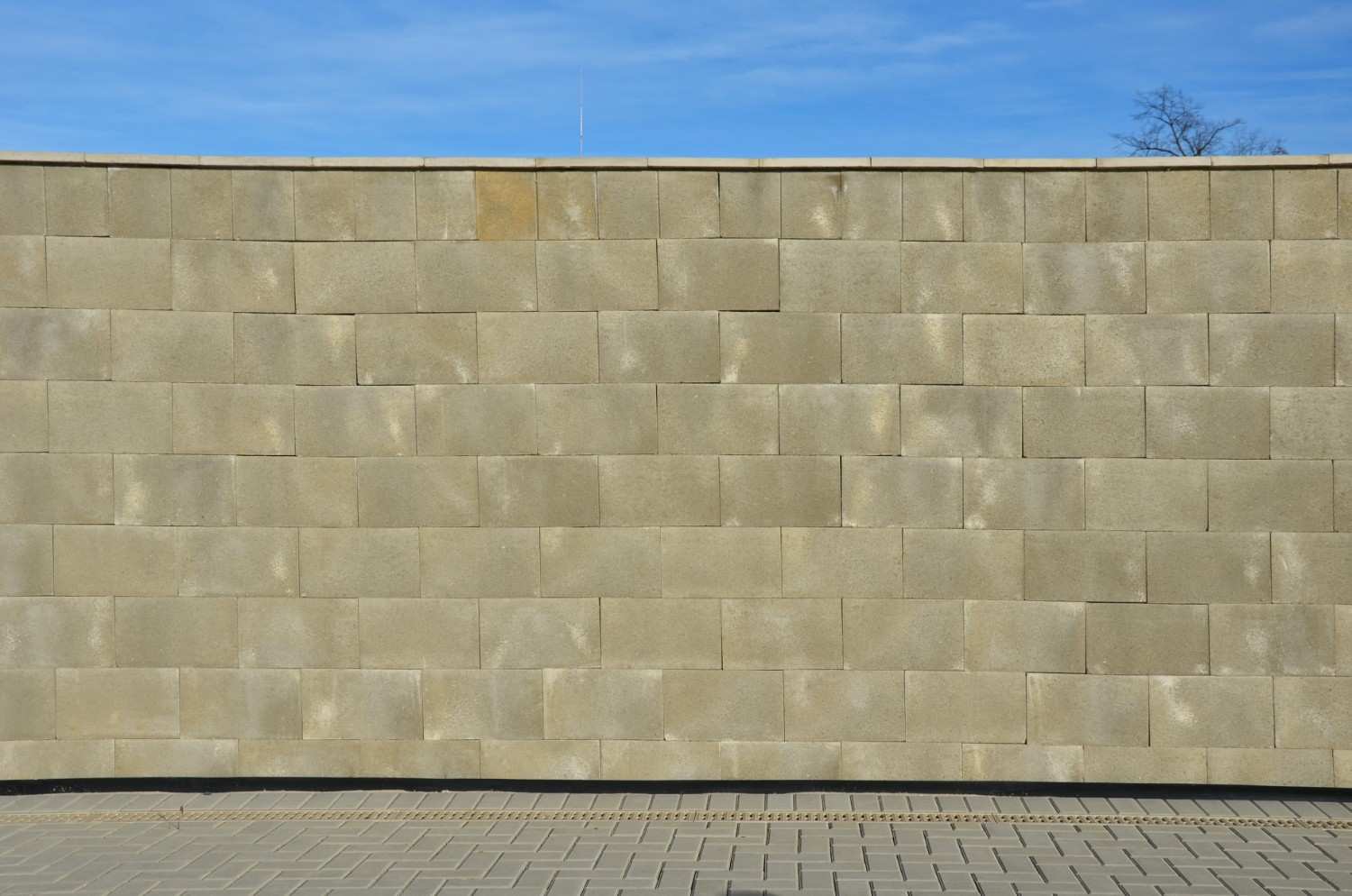 Completed concrete block retaining wall for building retaining walls winter outdoor landscaping.