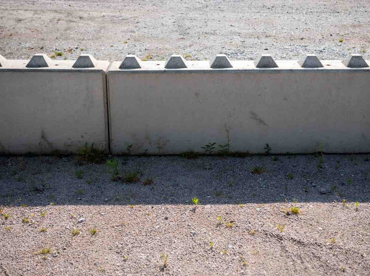 Interlocking precast concrete blocks forming a freestanding modular retaining wall on a Gold Coast site