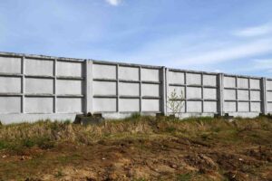 InfraBlock precast interlocking block retaining wall on a Gold Coast property before storm season